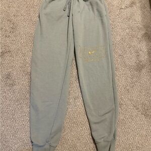 Nike women’s XS green Joggers with Gold Logo